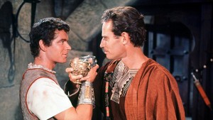 Messala (Stephen Boyd) and Ben-Hur (Charlton Heston) toast their friendship.